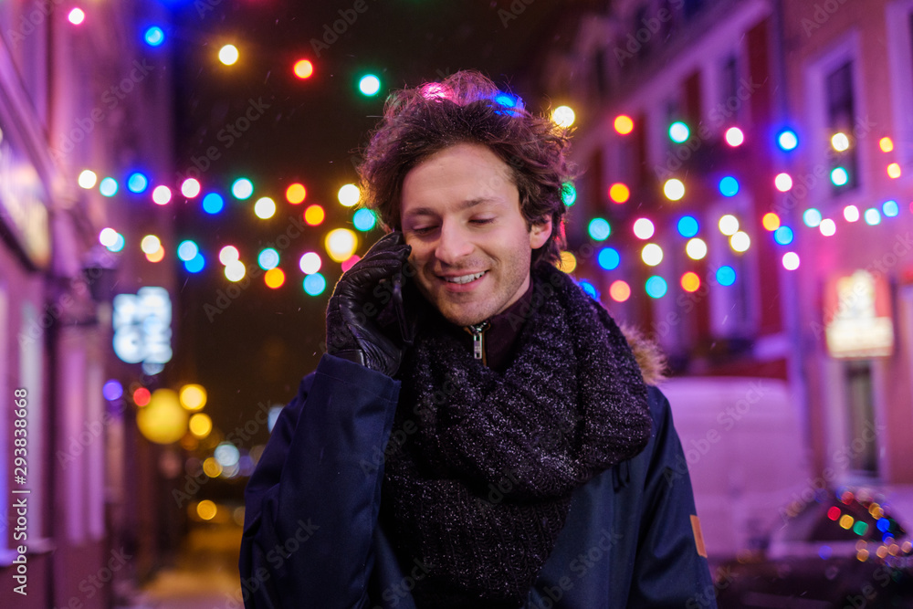 Man with a mobile phone on a cold winter evening Man with a mobile phone on a cold winter evening