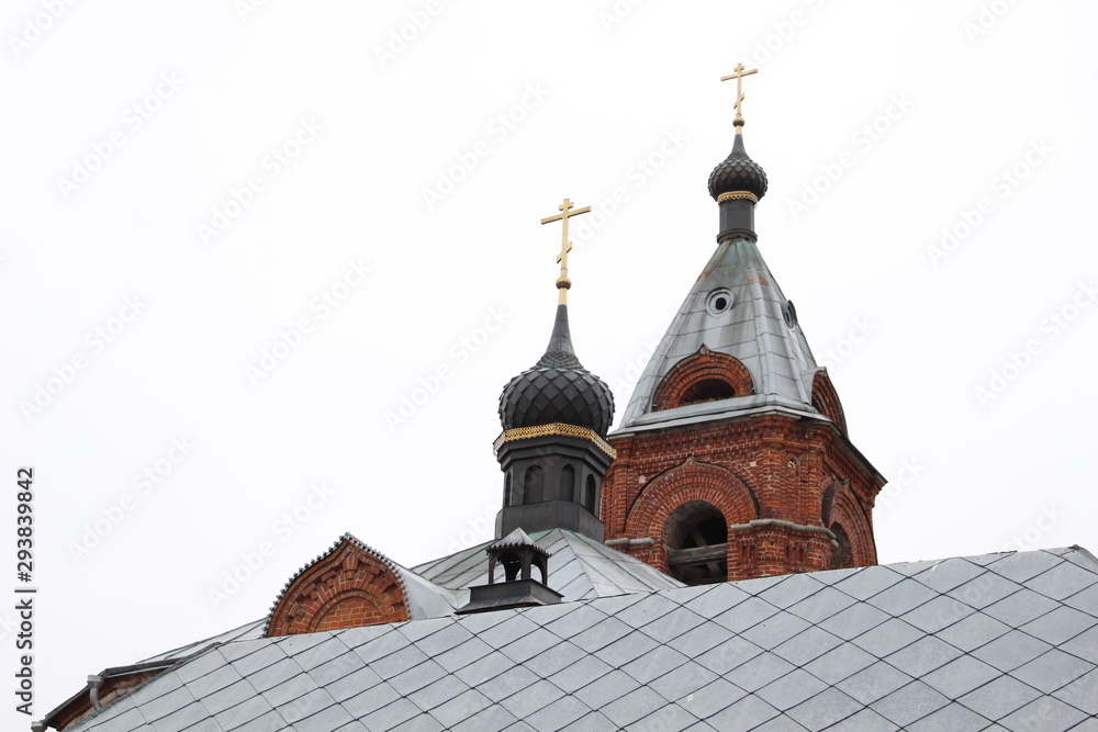 Red brick old church in Dunilovo village in cloudy day