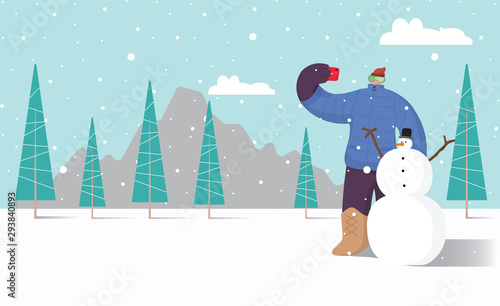 man doing selfie with snowman