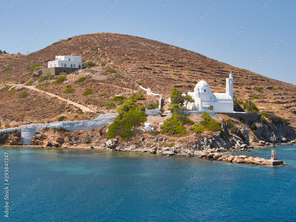 White Ortodox Church on seashore by mountain