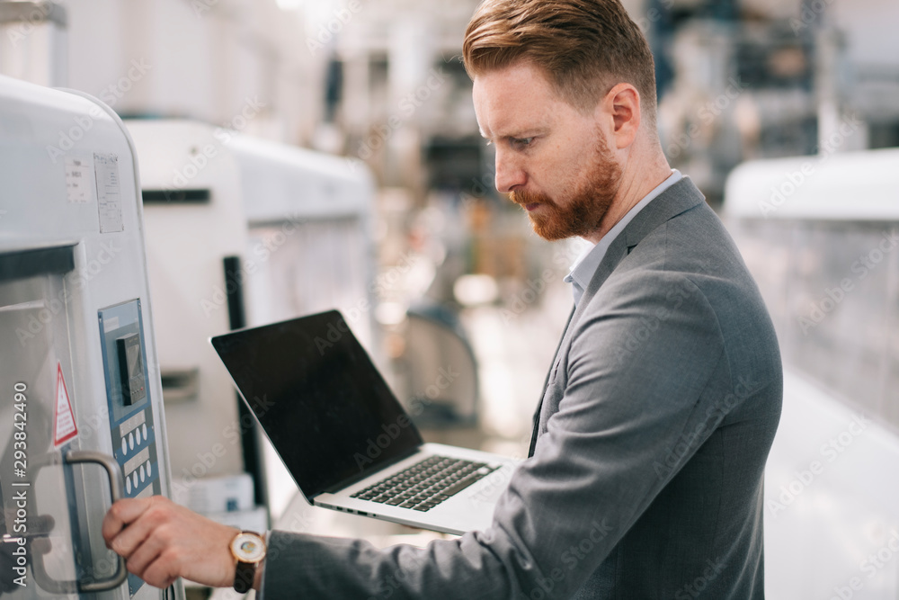 Manager checks machines at the factory. Inspector checks a factory. Manager checks machines at the factory. Inspector checks a factory.