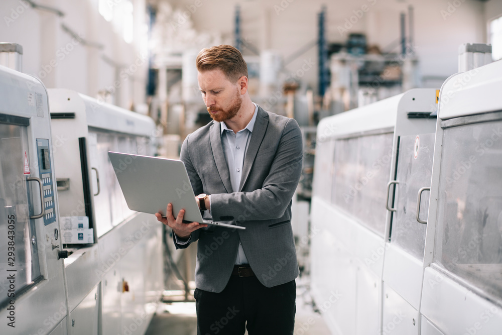 Manager checks machines at the factory. Inspector checks a factory. Manager checks machines at the factory. Inspector checks a factory.