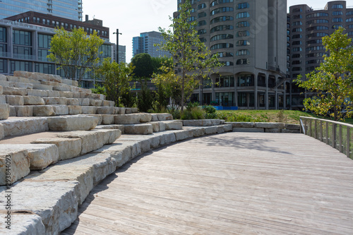 Stone Seating on the Riverwalk along the South Branch of the Chicago River in Downtown Chicago with Skyscrapers © James