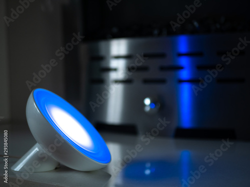 Smart home lamp light with coloured LED on fireplace - Dark Blue photo