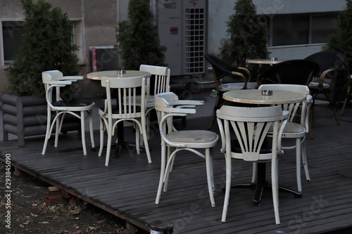 tables and chairs on the street veranda © Ruslan