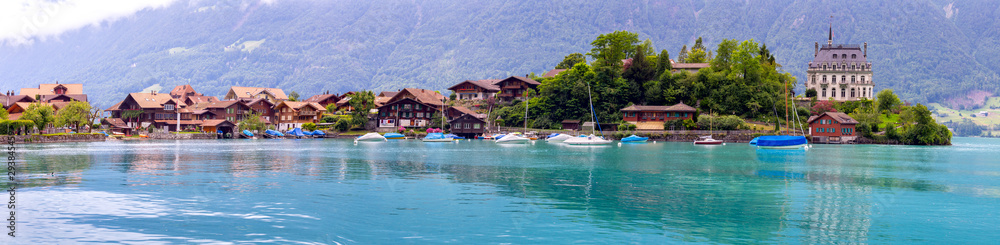 Panorama of the Swiss village of Iseltwald on the famous Lake Brienz. Switzerland.