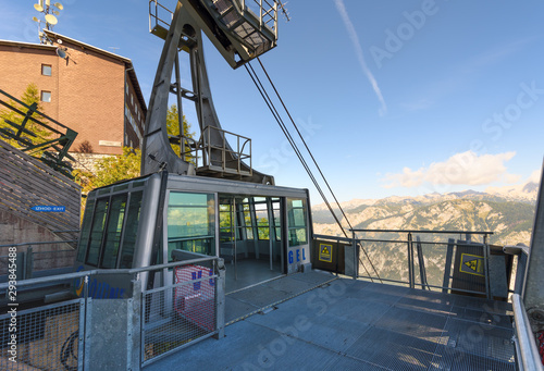 Vogel Cable Car that lifts visitors from Bohinj lake to Vogel ski center in Julian Alps, Slovenia. Opened door aerial tramway cabin on top station