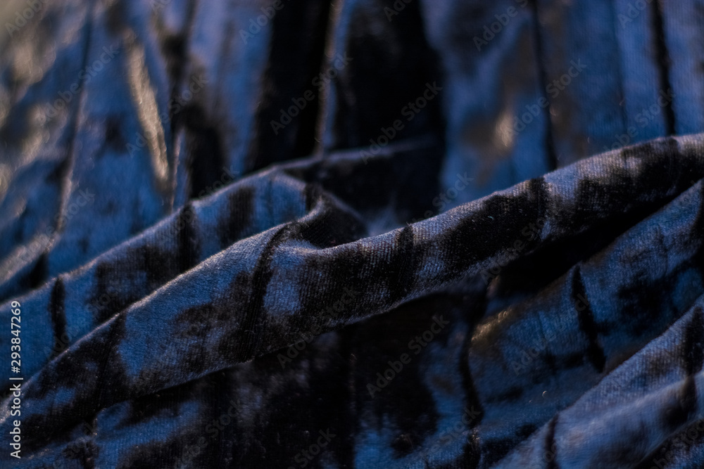 Background or texture of black and plain, iridescent, velor, corrugated fabric. Drapery. Background or texture of black and plain, iridescent, velor, corrugated fabric. Drapery.