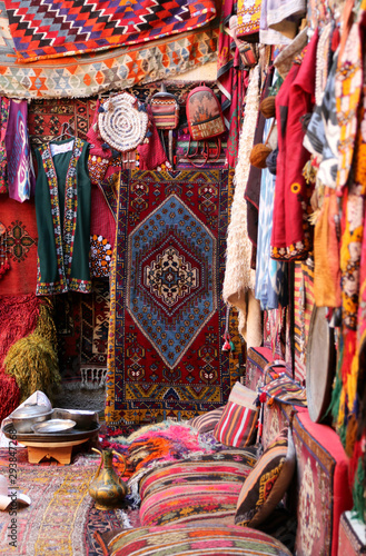  Traditional colorful rugs and carpets are decorated orientally in a carpet store in Cappadocia Turkey. © Maria Kasimova