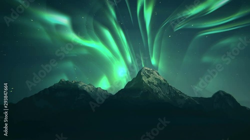 Aurora Borealis Green Northern Lights Mountains. Landscape aurora background. Starry night sky scenery.Northern lights or Aurora Borealis above snow covered rocks. Winter landscape with polar lights. photo