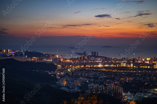 China. Hainan Island. Evening view from the mountain in Phoenix Park of the city and the sea