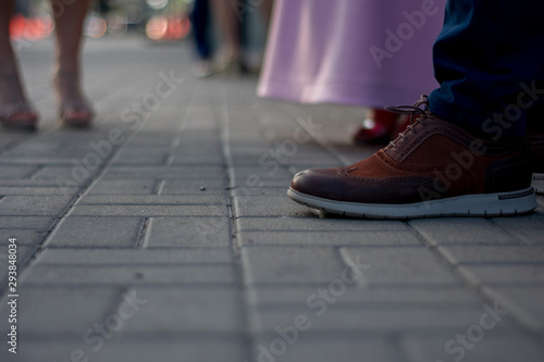feet of people walking on the street