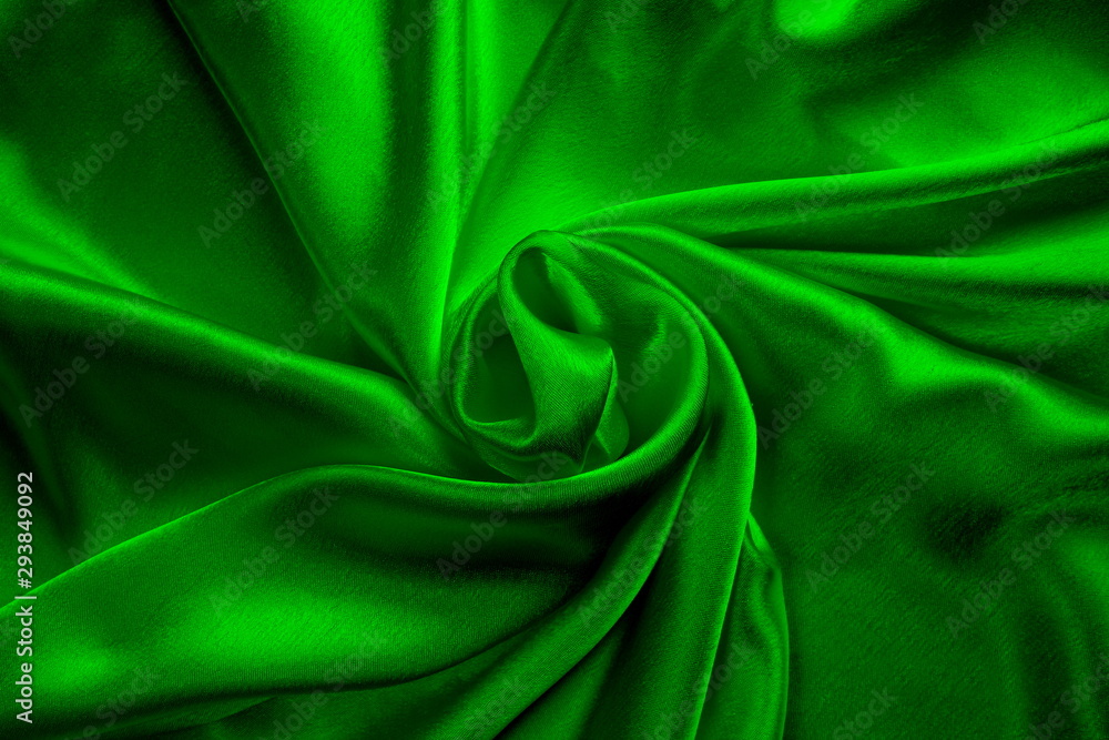 green silk delicate fabric twisted and folded in drapery green silk delicate fabric twisted and folded in drapery