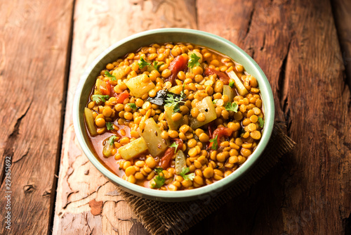Lauki / Doodhi Chana Dal Subji or Bottlegourd Gram Curry, served in a bowl.selective focus photo