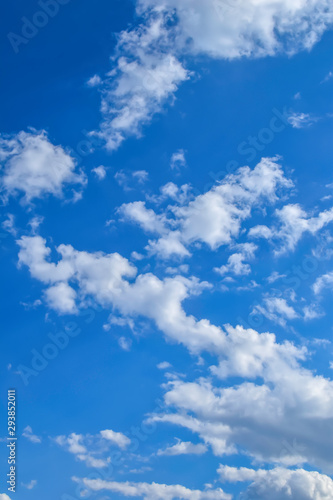 White clouds can be seen in a bright blue sky.