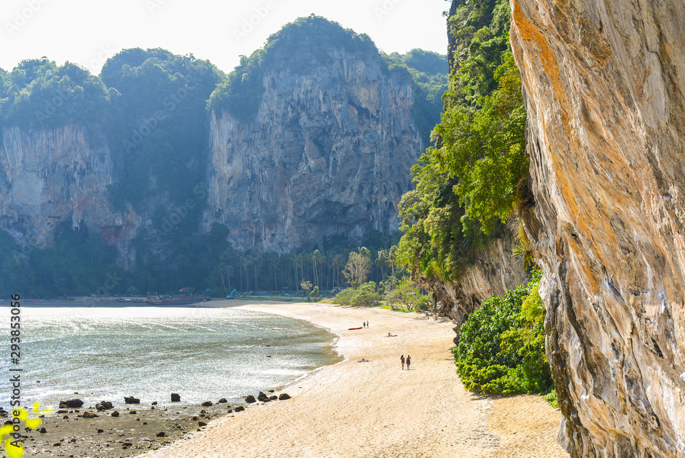 Tonsai Beach in low season (July). An almost empty strip of sand, steep cliffs, and jungles. Ton Sai is a more secluded and budget location of famous Railay Peninsula. Traveling in Krabi, Thailand.