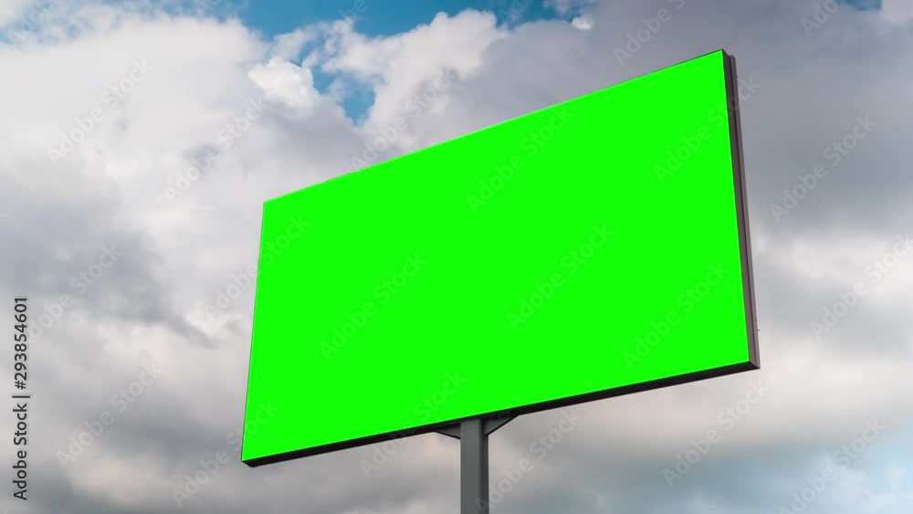 Timelapse - blank green billboard or large advertising display and moving white clouds against blue sky. Consumerism, chroma key, time lapse, green screen, template, mock up, copy space, concept Timelapse - blank green billboard or large advertising display and moving white clouds against blue sky. Consumerism, chroma key, time lapse, green screen, template, mock up, copy space, concept