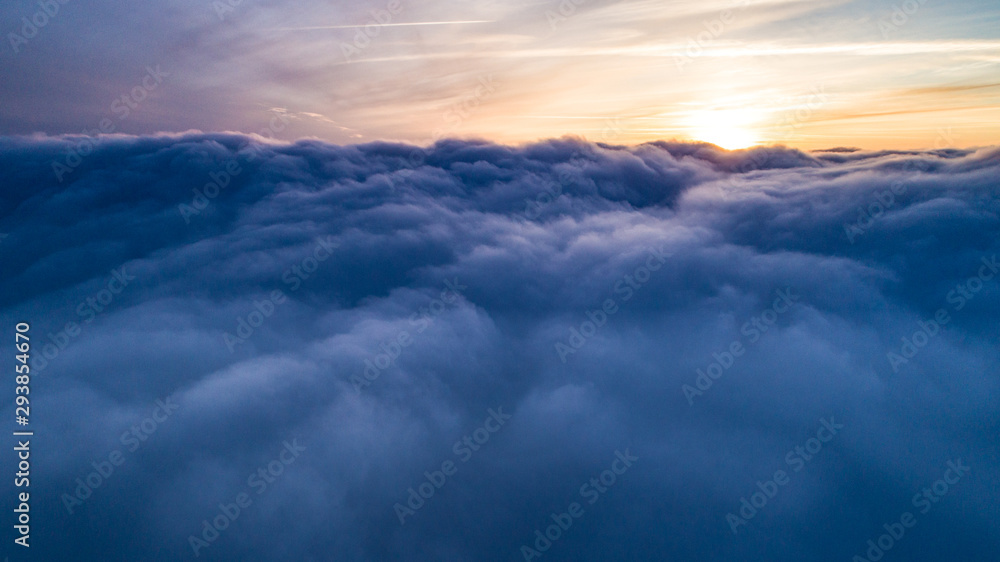 Obraz premium Magical view of cumulus clouds in winter at sunset
