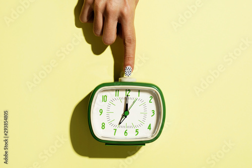 wowan turning off a retro alarm clock photo