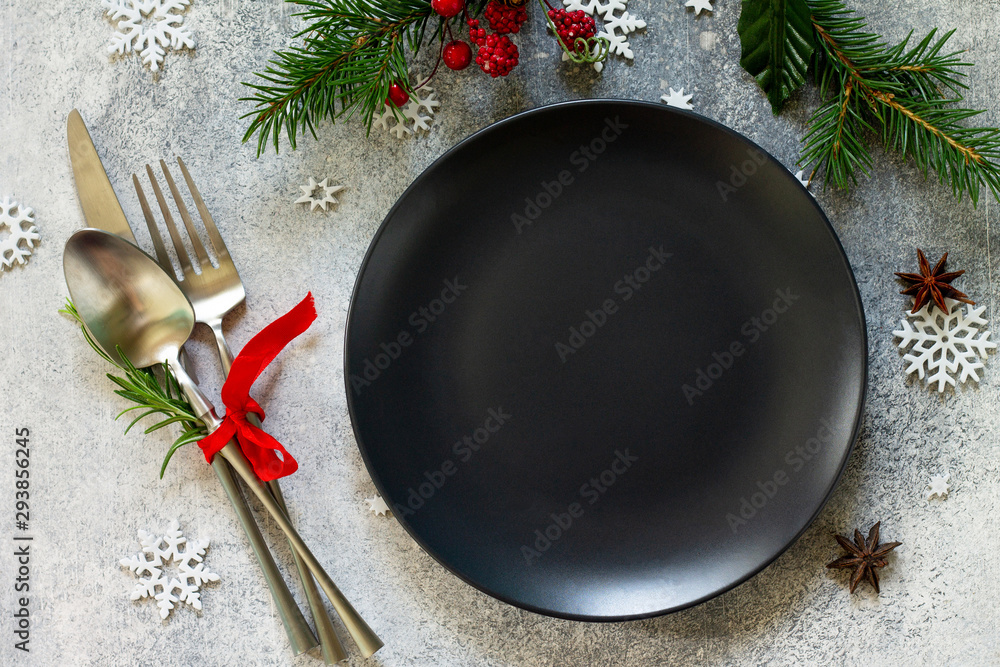 Elegant Christmas table setting. Festive and cutlery with Christmas decor on festive table. Top view flat lay. Elegant Christmas table setting. Festive and cutlery with Christmas decor on festive table. Top view flat lay.