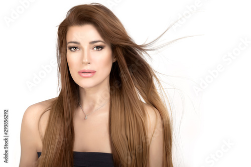 Beautiful model girl with healthy long hair. Keratin smoothing treatment. Care and hair style products