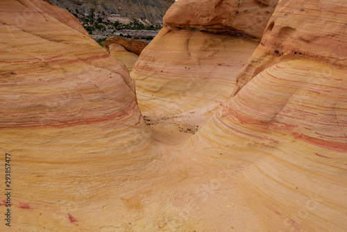Landscape of three intertwined striped rock formations at Ojito Wilderness in New Mexico