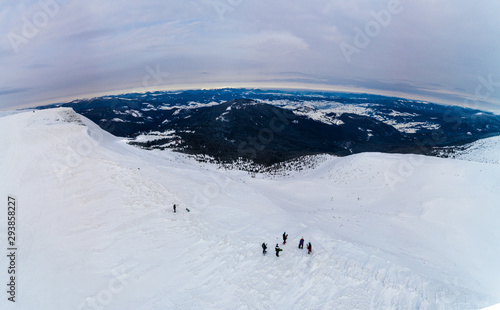 Amazing aerial view of a hill with skiers © YouraPechkin