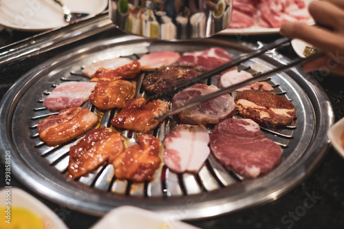 Pork grill on hot coals, Korean or Japanese BBQ Yakiniku style. (vintage tone)