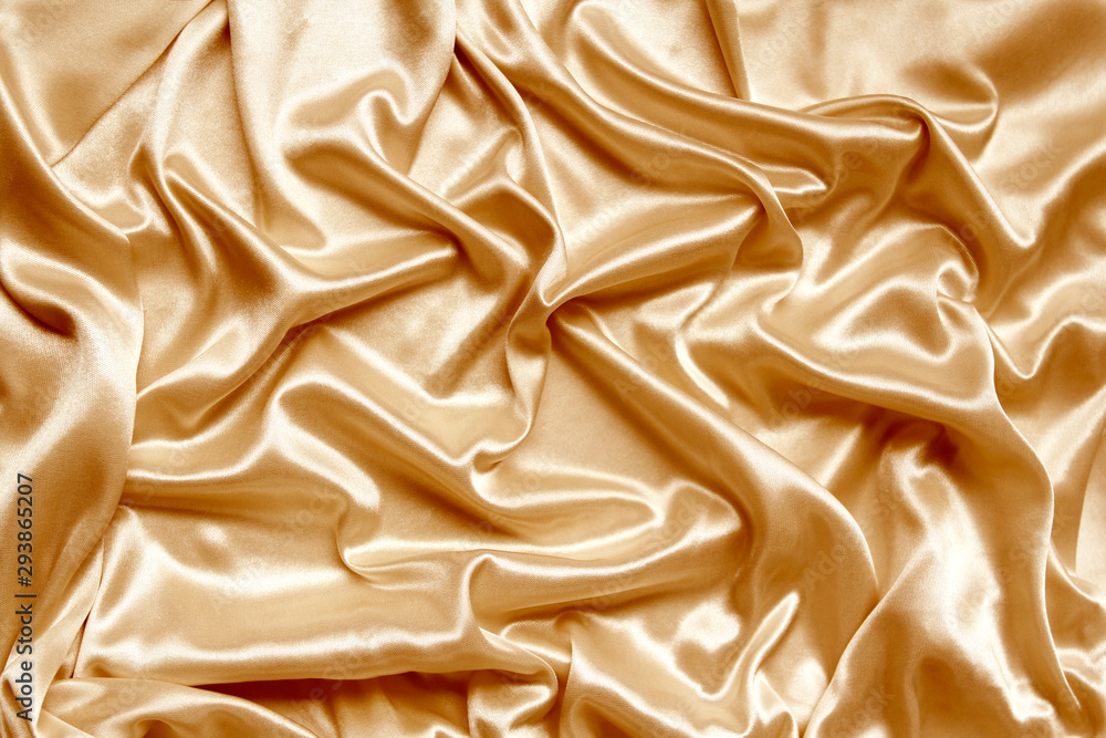 gold beautiful satin fabric draped with soft folds, silk cloth