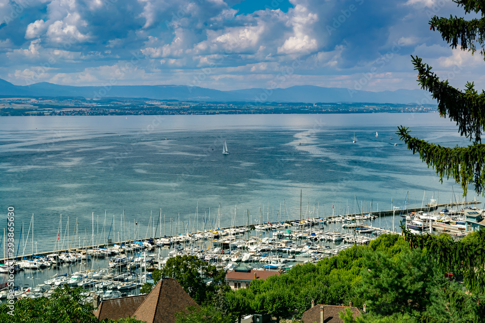 View from the viewpoint of the port of Thonon les Bains, boats, Lake Geneva, and the blue sky with clouds.Haute-Savoie in France.