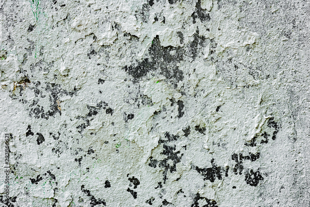 Texture of a concrete wall with cracks and scratches which can be used as a background Texture of a concrete wall with cracks and scratches which can be used as a background