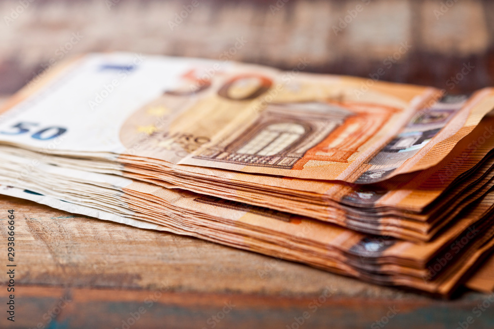 Pile of fifty euro banknotes.