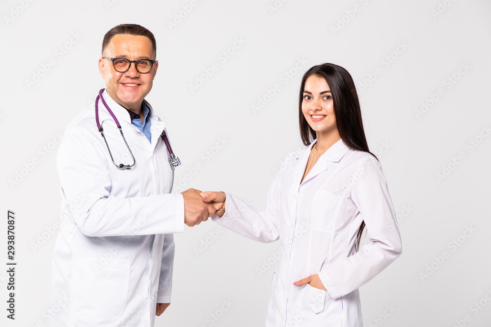 Portrait of two medical people handshaking, isolated on white background Portrait of two medical people handshaking, isolated on white background