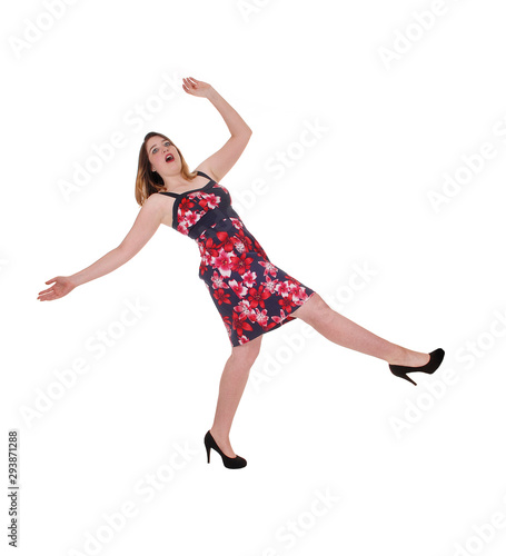Woman falling backwards in a colorful dress