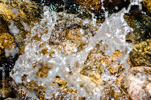Water splash in a river after throwing a stone © Fernando
