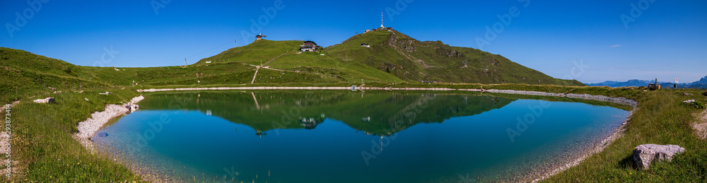 High resolution stitched panorama of a beautiful alpine view with reflections in a lake at the famous Kitzbüheler Horn, Kitzbühel, Tyrol, Austria