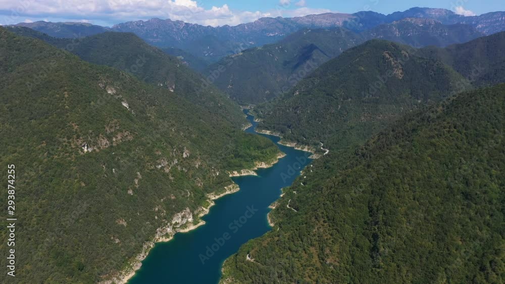Magnificent panoramic view of the Valvestino lake. The lake is surrounded by the Alps, near Lake Garda, Italy Magnificent panoramic view of the Valvestino lake. The lake is surrounded by the Alps, near Lake Garda, Italy
