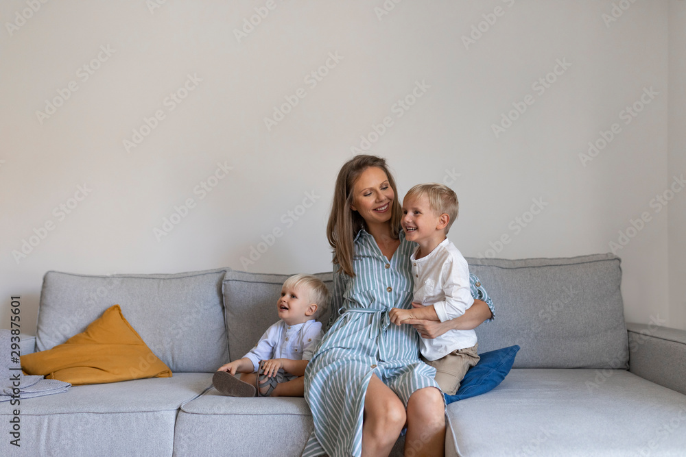 Portrait of happy family - mother and toddler sons. Portrait of happy family - mother and toddler sons.