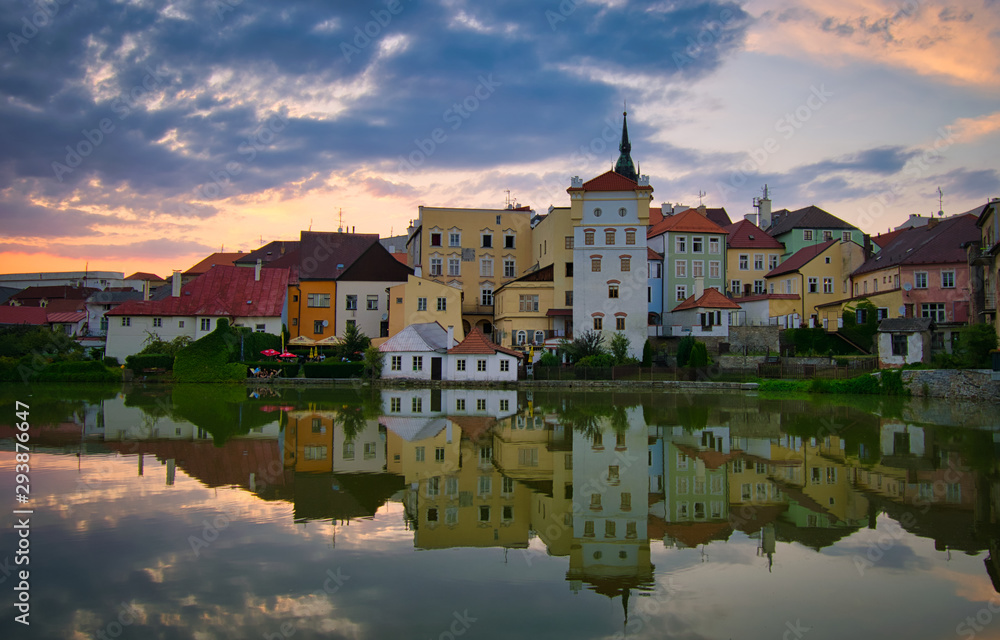 J. Hradec city at sunset view across pond