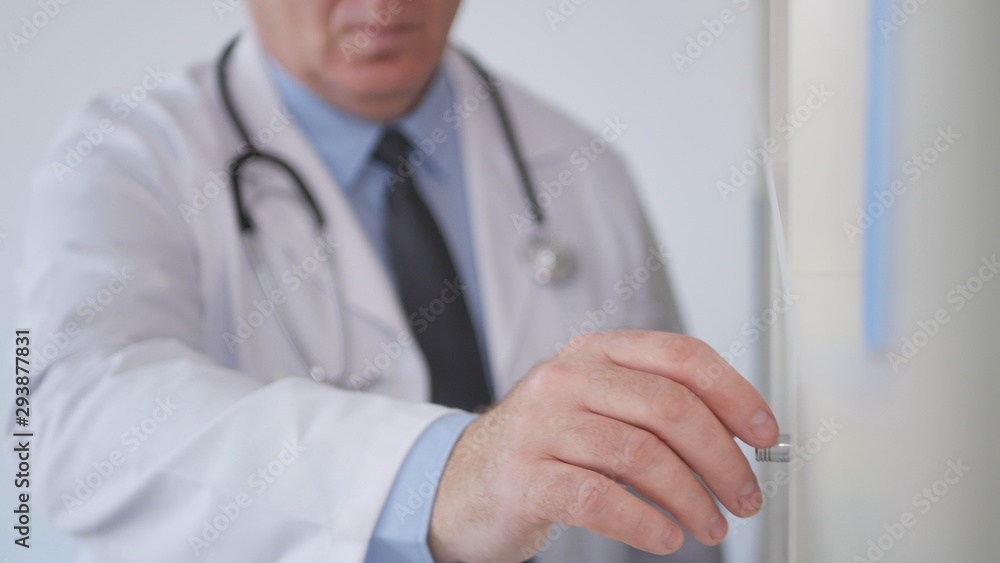 Doctor Open a Drawer with Documents in Hospital Medical Archive