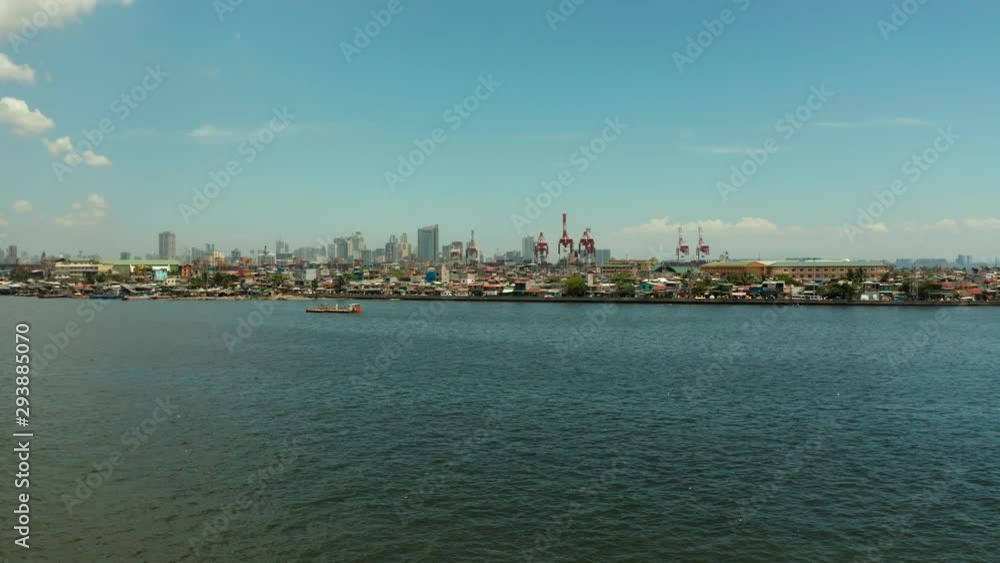 Manila city with port, skyscrapers, modern buildings and Makati business center aerial drone. Travel vacation concept Manila city with port, skyscrapers, modern buildings and Makati business center aerial drone. Travel vacation concept