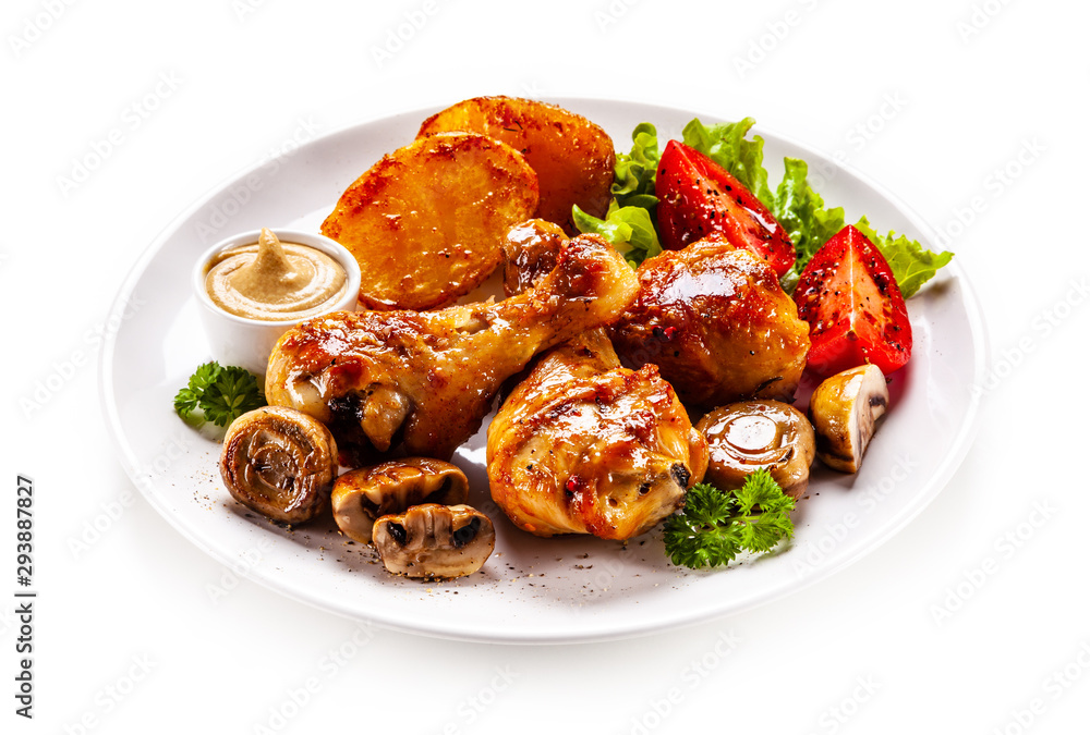Grilled chicken drumsticks with baked potatoes and vegetables Grilled chicken drumsticks with baked potatoes and vegetables