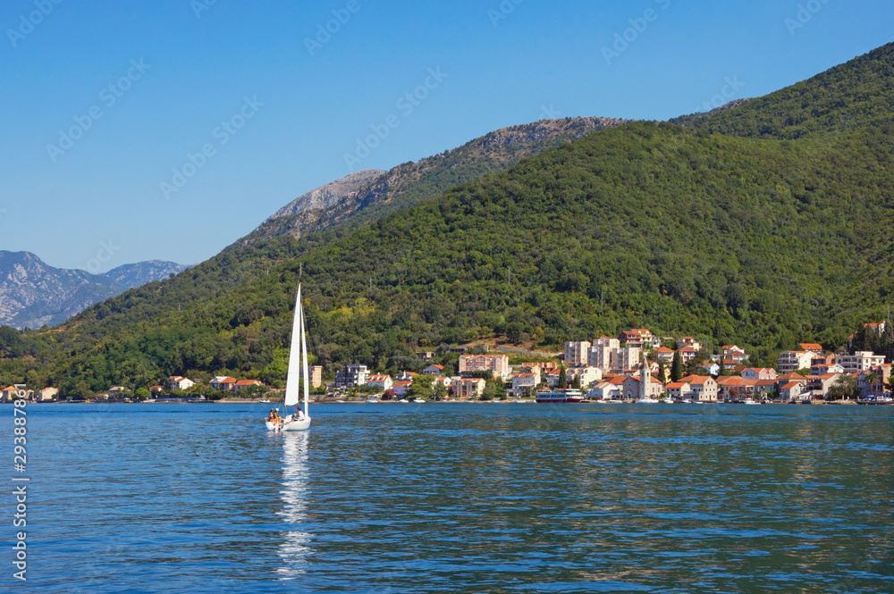 Obraz premium Beautiful summer Mediterranean landscape. Montenegro, Adriatic Sea. View of Bay of Kotor and Donja Lastva village ( near Tivat city ) in distance