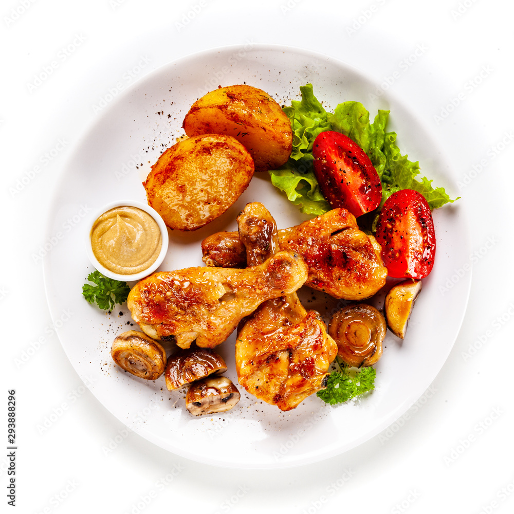 Grilled chicken drumsticks with baked potatoes and vegetables Grilled chicken drumsticks with baked potatoes and vegetables