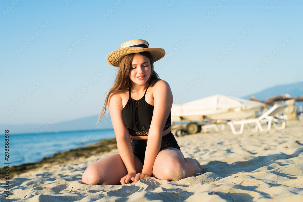 custom made wallpaper toronto digitalCheerful plus size teenage girl wearing hat enjoying the beach. smiling, happy, positive emotion, summer style.