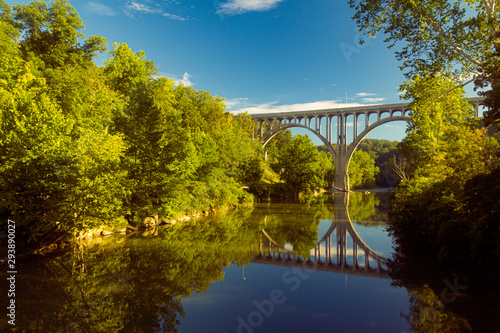 Arch bridge spanning a river in Cuyahoga Valley National Park