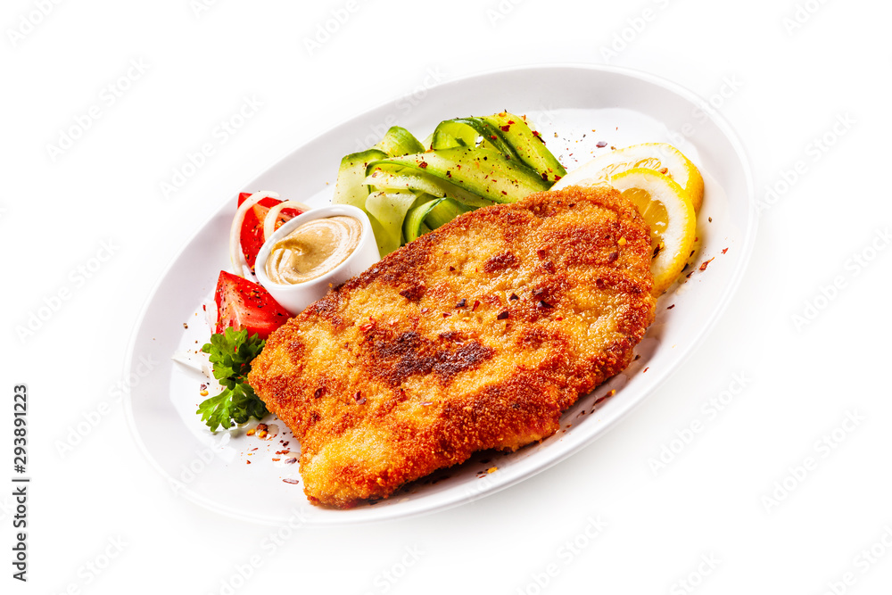 Fried pork chop and vegetable salad on white background Fried pork chop and vegetable salad on white background