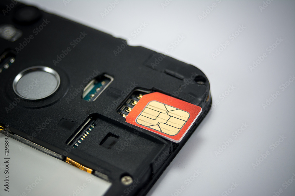 SIM card close-up next to the connector in the smartphone, phone SIM card close-up next to the connector in the smartphone, phone