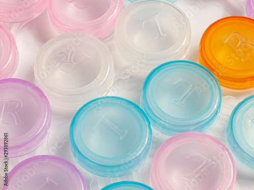 containers for soft contact lenses, multi-coloured, plastic, for cleaning and storage, close up