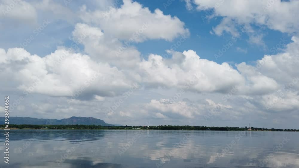 blue sky with cloud reflection in water blue sky with cloud reflection in water